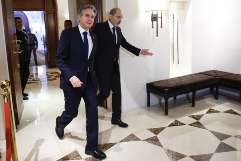 US Secretary of State Antony Blinken (L) is received by Jordanian Foreign Minister Ayman Safadi, as fears of a regional war mount