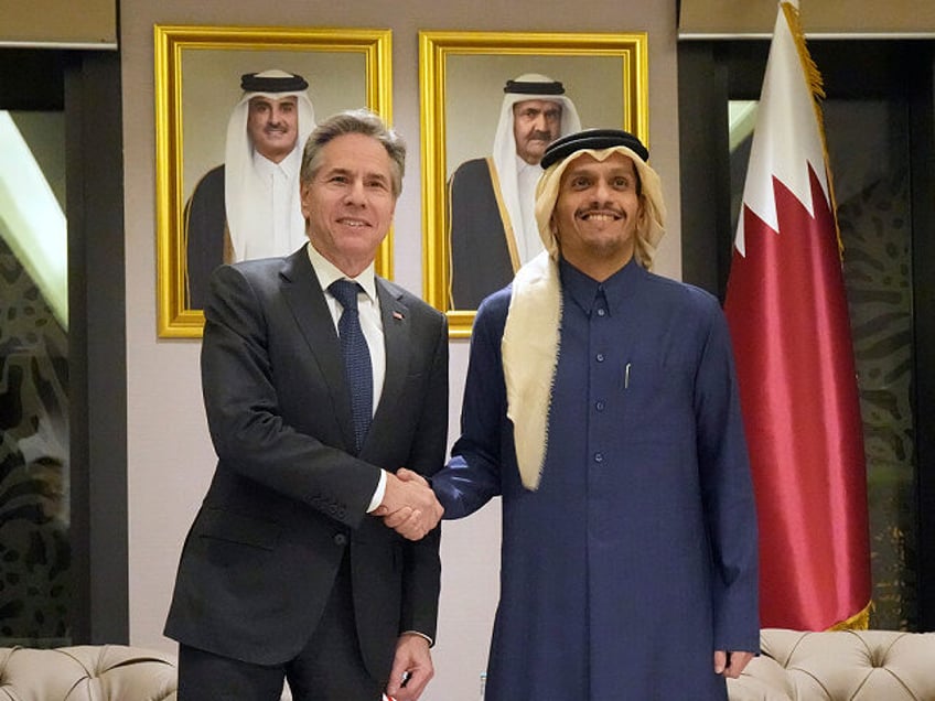 US Secretary of State Antony Blinken, left, shakes hands with Qatar's Prime Minister and Foreign Affairs Minister Mohammed Bin Abdulrahman Al Thani, at Diwan Annex, in Doha, Qatar, Tuesday, Feb. 6, 2024. (AP Photo/Mark Schiefelbein, Pool