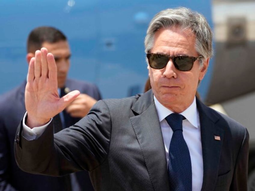 US Secretary of State Antony Blinken gestures upon his arrival at Cairo airport, on June 1