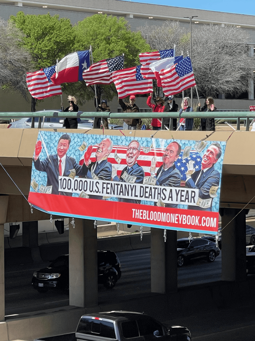 blood money anti fentanyl banner appears over dallas highway