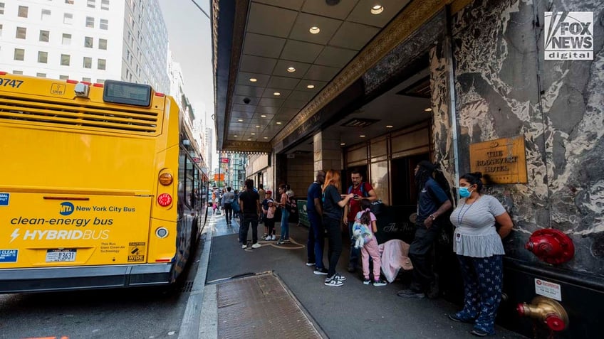 Migrants arrive at the Roosevelt Hotel in Manhattan