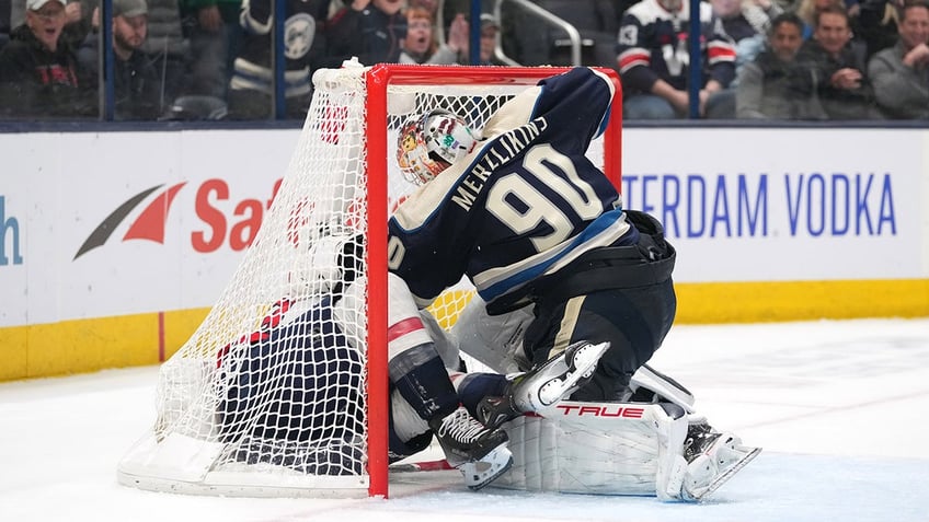 Elvis Merzlikins fights Tom Wilson