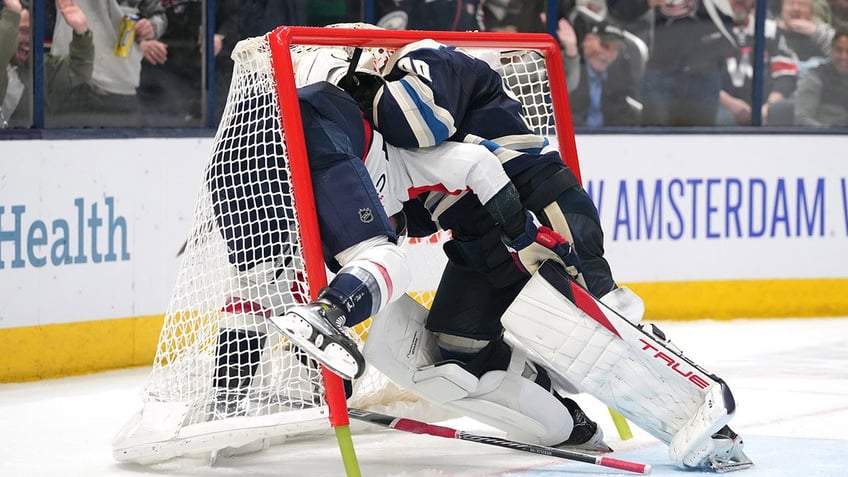 Elvis Merzlikins fights tom Wilson