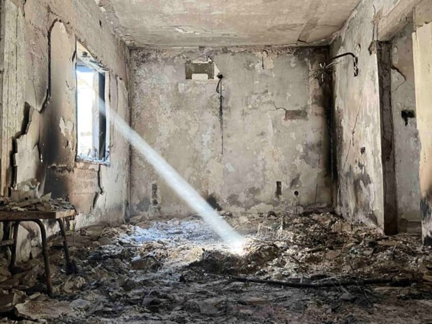 A ray of light illuminates the dust and gloom in the ruins of the Katzir family home, Kibbutz Nir Oz, Israel, November 21, 2023 (Joel Pollak / Breitbart News)