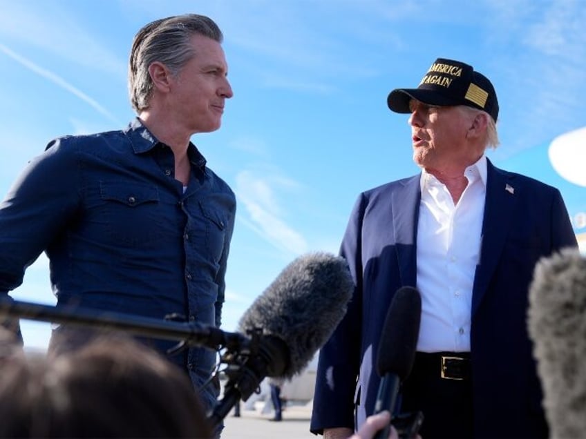 President Donald Trump talks with California Gov. Gavin Newsom after arriving on Air Force