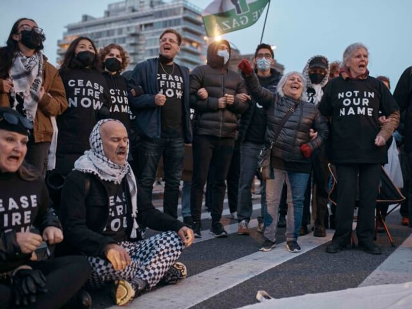 Protesters block traffic during a pro-Palestinian demonstration demanding a permanent ceas