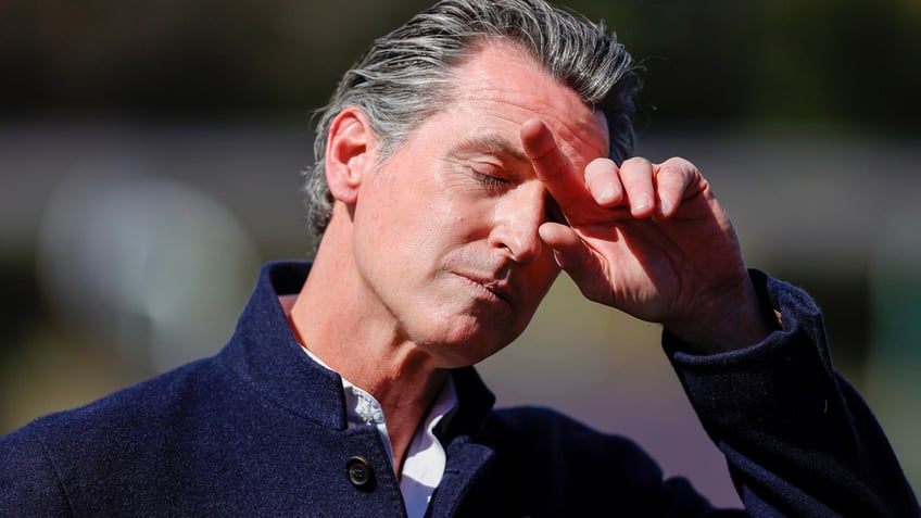 California Gov. Gavin Newsom with hand on face