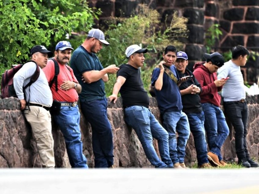 NEW JERSEY, UNITED STATES - AUGUST 04: Immigrants, mostly from South America, wait for veh