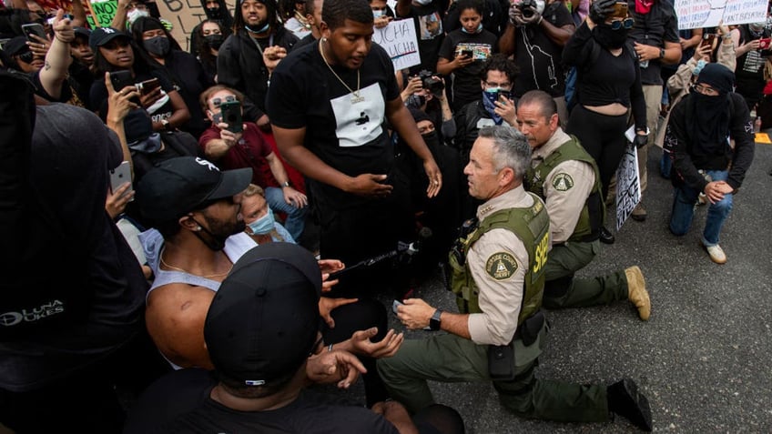 Bianco takes knee with protesters