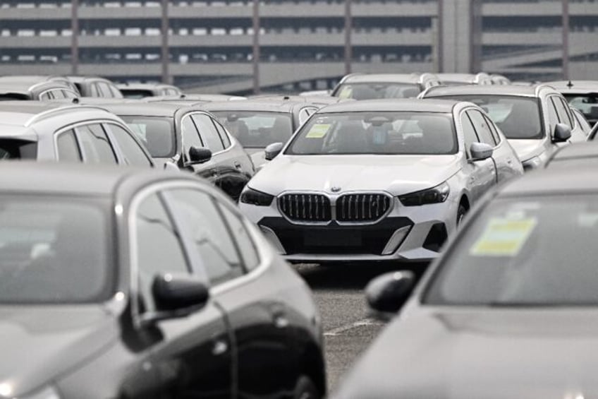 BMW joins other German automakers in reporting sharply lower profits amid a choppy transit