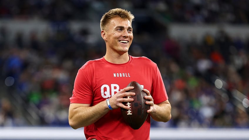 Bo Nix smiles at NFL Combine