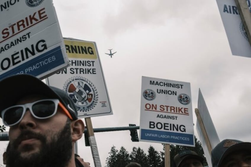 Boeing says that ending a strike involving tens of thousands of Seattle-area workers is a