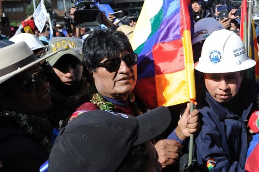 Former Bolivian president Evo Morales (C) is under investigation for the rape of a minor