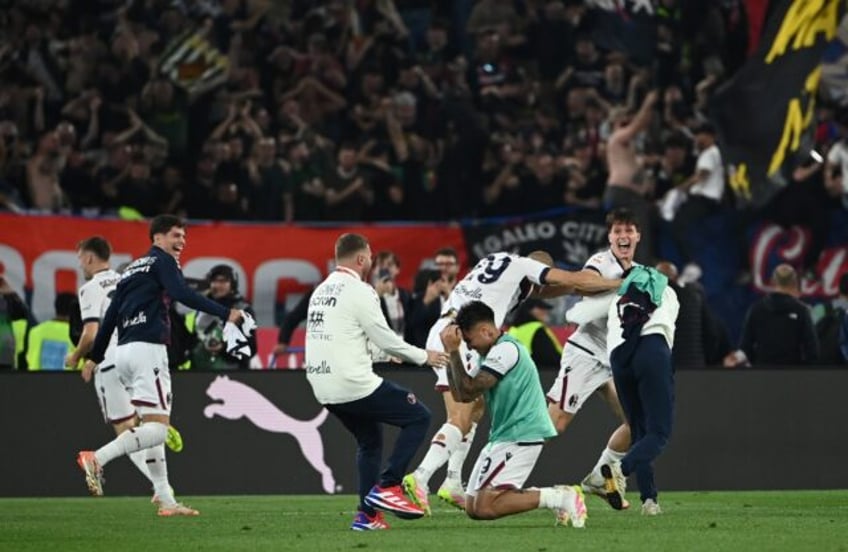 Bologna players celebrate winning the Italian Cup
