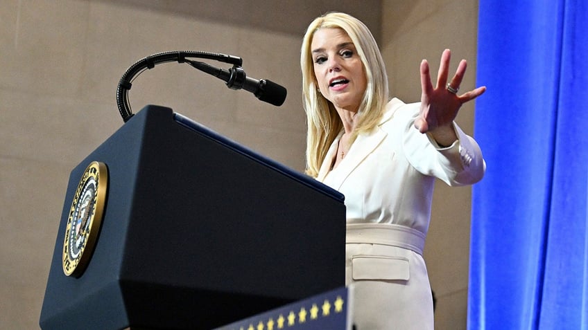 Attorney General Pam Bondi speaks before Justice Department officials.