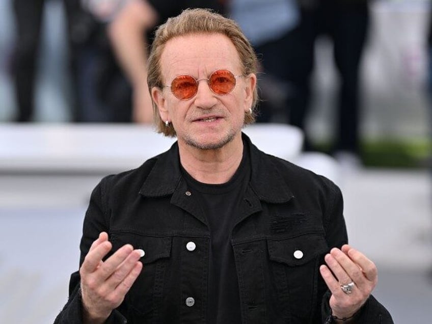 Irish singer of U2 Bono poses during a photocall for the film 'Bono: Stories of Surrender'
