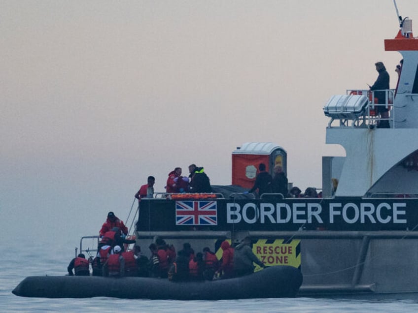 THE ENGLISH CHANNEL, ENGLAND - AUGUST 24: The BF Hurricane, a border force vessel arrives to collect around 50 migrants drifting into English waters after being accompanied by a French tug from the French coastline on August 24, 2023 The English Channel, England. Most of the small boats are collected …