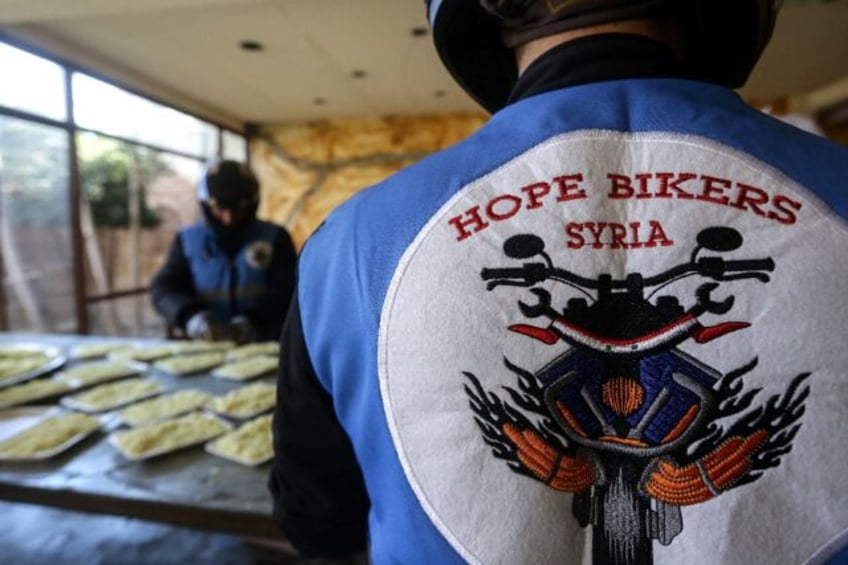 The bikers don their club's signature vest when they ride off to deliver food so Muslims r