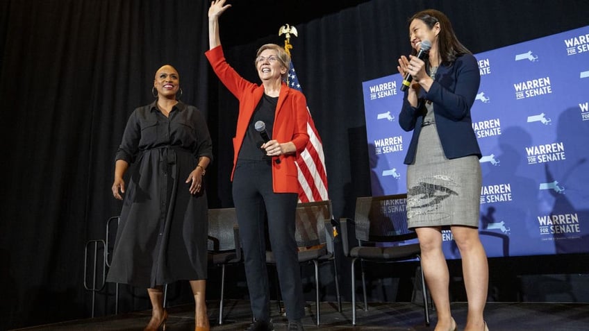 Senator Elizabeth Warren, a Democrat from Massachusetts, center, with Boston Mayor Michelle Wu, right, and Congresswoman Ayanna Pressley during a town hall event 