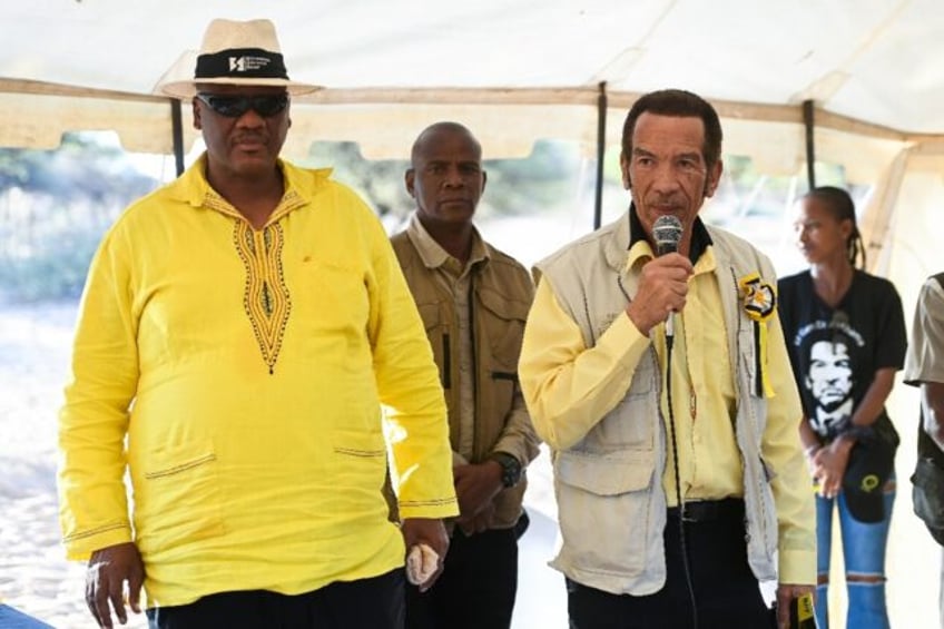 Former Botswana president Ian Khama (R) has been campaigning against the incumbent he had