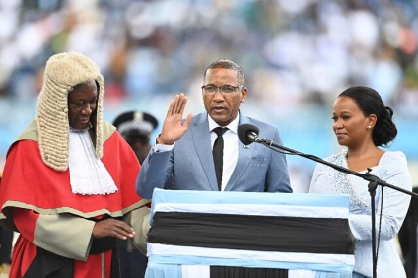 Botswana’s new president Duma Boko (C) was sworn in, a week after his landslide election