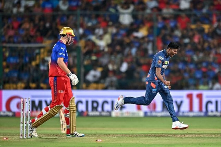 Lucknow Super Giants' Mayank Yadav celebrates after taking the wicket of Royal Challengers