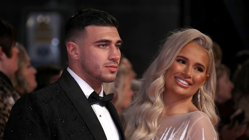 Tommy Fury and Molly-Mae Hague pose on red carpet