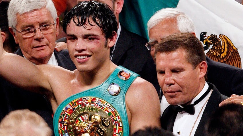 Julio Cesar Chavez, Jr. holds the belt