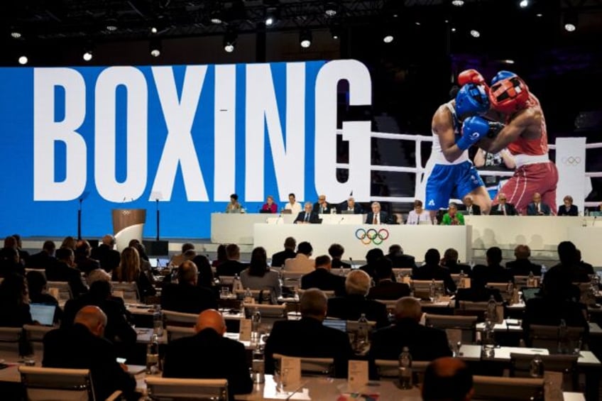 IOC members at a Session in Costa Navarino in Greece vote for the inclusion of boxing at t