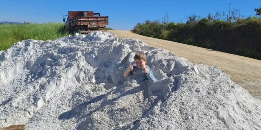 boy photographed playing in dust pile dies moments later tragic