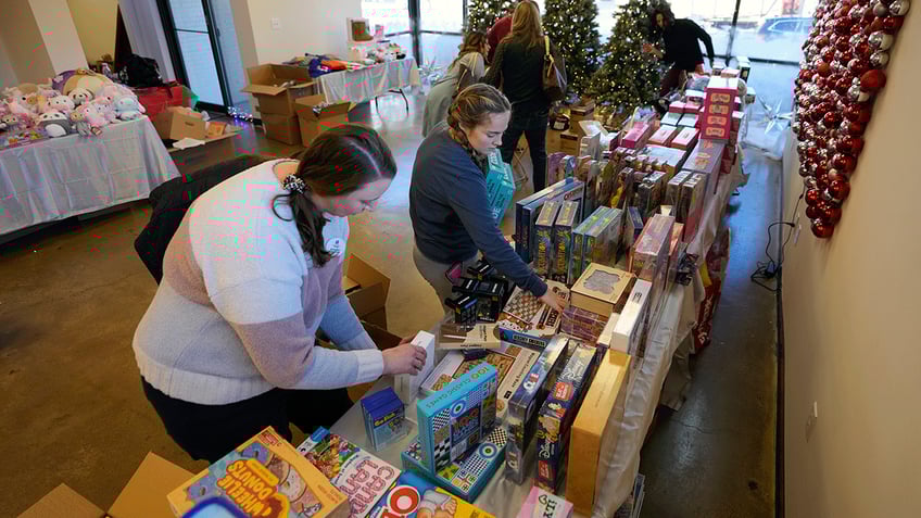 Volunteers getting the Toy Store ready for guests