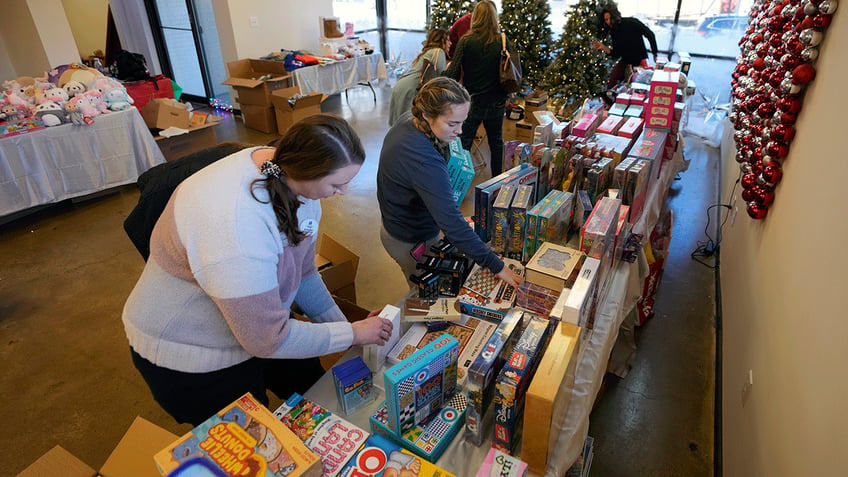 Volunteers getting the Toy Store ready for guests