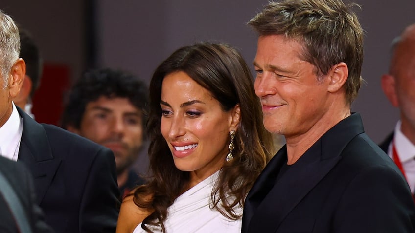 Ines de Ramon and Brad Pitt attend a movie premiere together