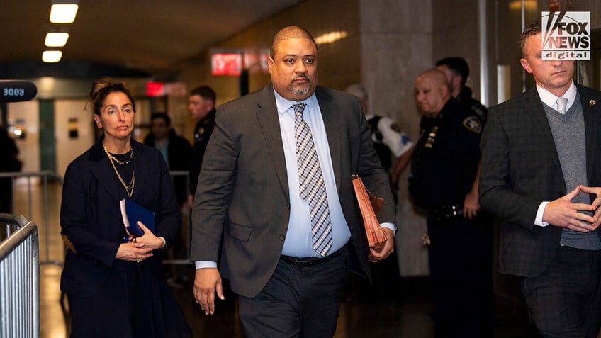 Manhattan District Attorney Alvin Bragg walks in the hallways of Manhattan Supreme Court