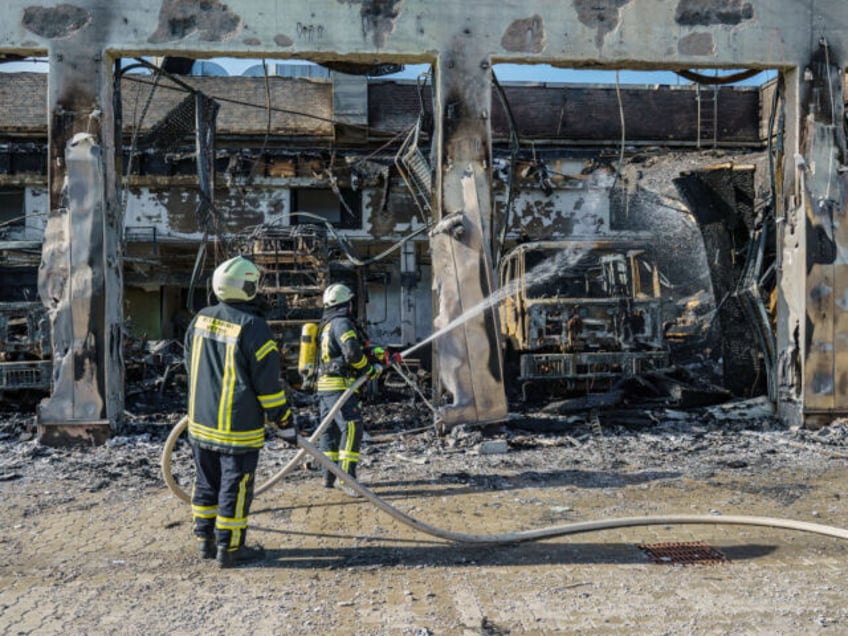 16 October 2024, Hesse, Stadtallendorf: The firefighters are busy putting out the fire. Th