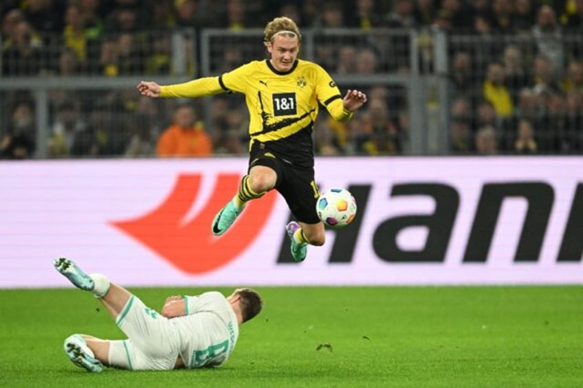 brandt sinks bremen to send dortmund top of bundesliga