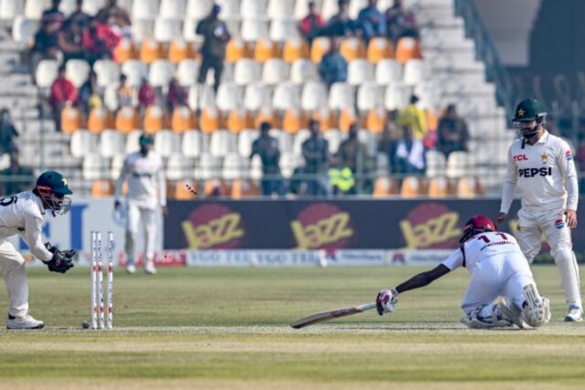 Pakistan wicketkeeper Mohammad Rizwan stumps West Indies captain Kraigg Brathwaiteafter a