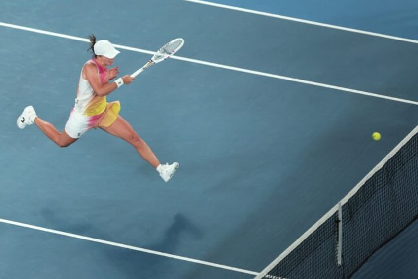 Poland's Iga Swiatek hits a shot against USA's Madison Keys