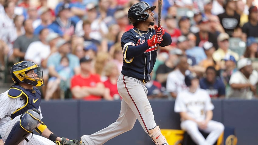 braves rally behind ozzie albies clutch three run home run in win over brewers