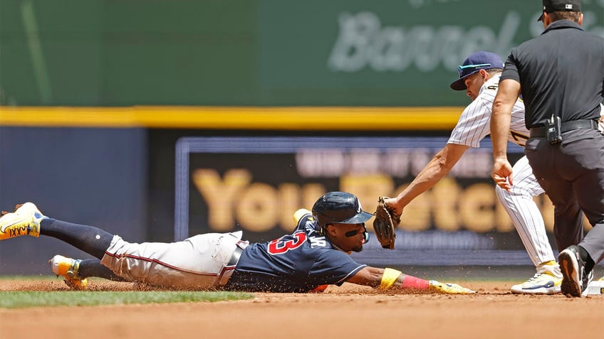 braves rally behind ozzie albies clutch three run home run in win over brewers