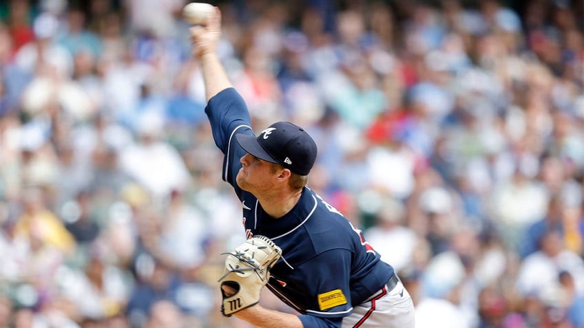 braves rally behind ozzie albies clutch three run home run in win over brewers