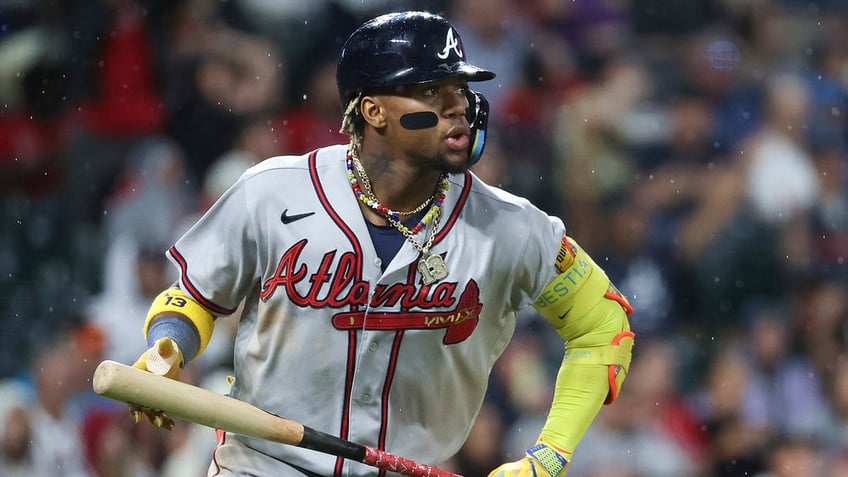 braves ronald acuna jr knocked over in wild scene at coors field as security wrestles fans wanting hug