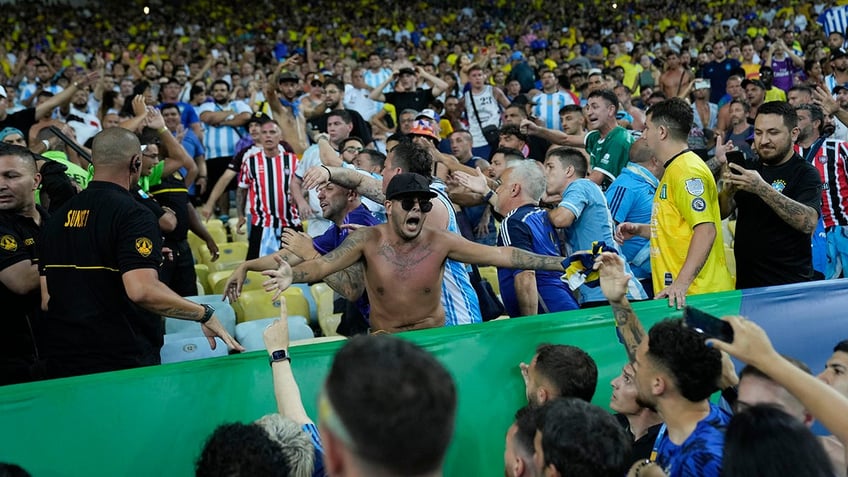 brazil argentina world cup qualifier delayed after fans brawl in stands