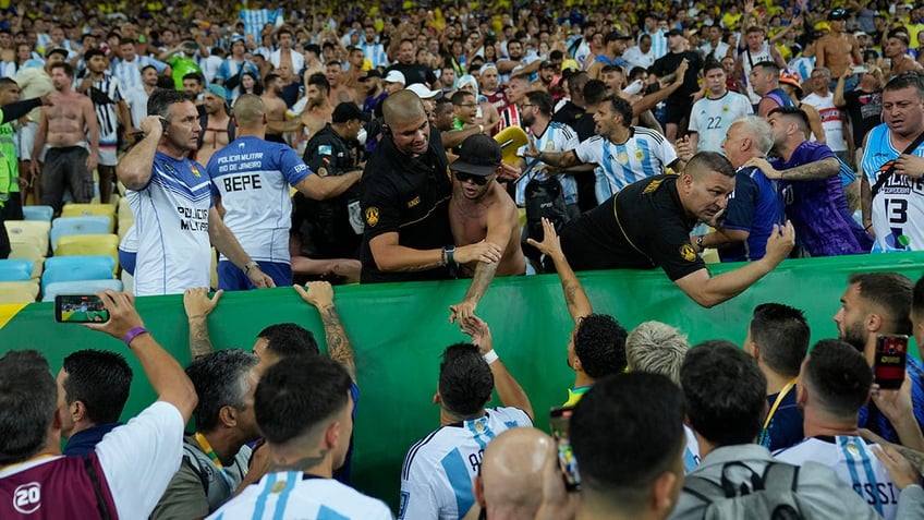 brazil argentina world cup qualifier delayed after fans brawl in stands