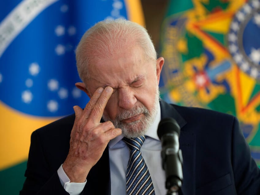 Brazilian President Luiz Inacio Lula da Silva pauses before answering a journalist's