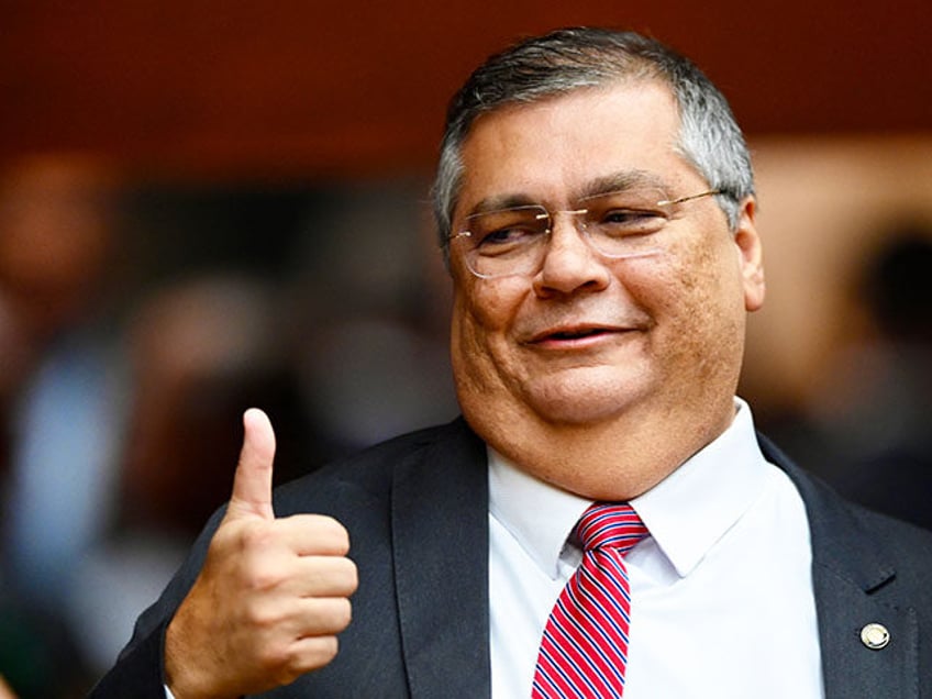 Brazilian Justice Minister Flavio Dino gestures during Supreme Court judge Luis Roberto Ba