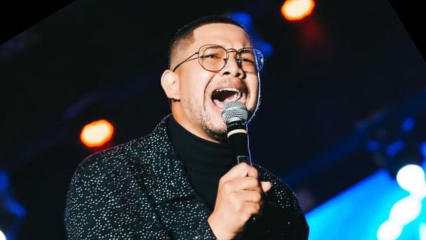 Brazilian Gospel singer Pedro Henrique singing on stage