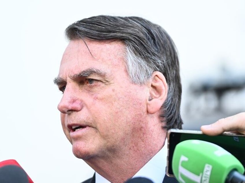 Jair Bolsonaro, Brazil's former president, speaks to members of the media after depar