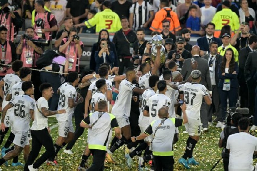 Botafogo players celebrate with the trophy after winning the Copa Libertadores final footb