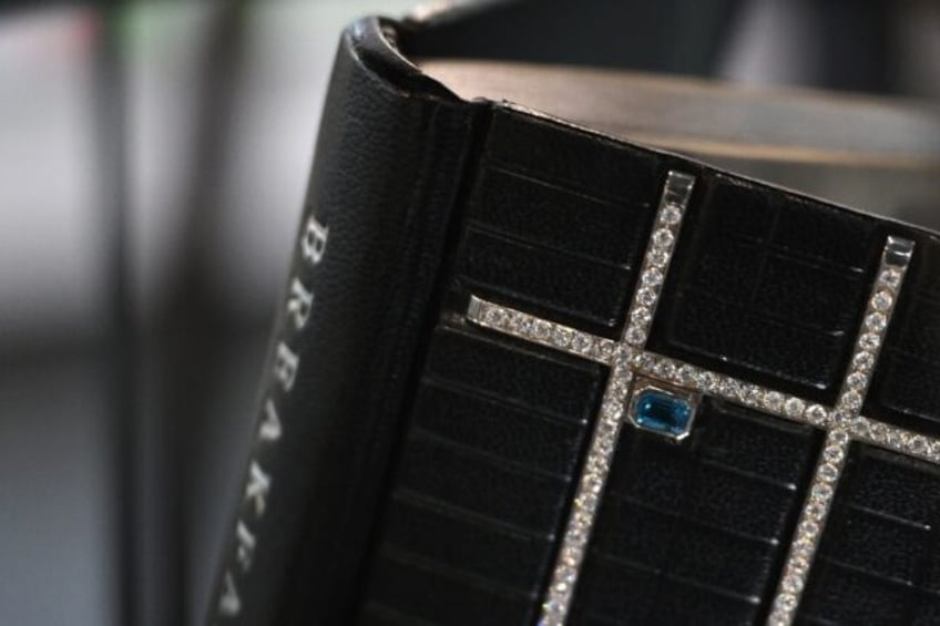 The one of a kind volume is signed by the author and decorated with almost 30 carats of di